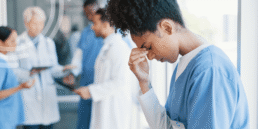 Healthcare professional reviewing preoperative documentation and patient records to identify common preoperative documentation mistakes before surgery.