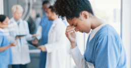 Healthcare professional reviewing preoperative documentation and patient records to identify common preoperative documentation mistakes before surgery.