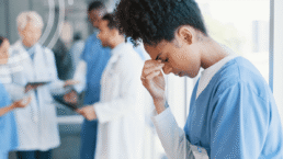 Healthcare professional reviewing preoperative documentation and patient records to identify common preoperative documentation mistakes before surgery.